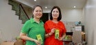 Thi Vui (in red) and her daughter at their’ melaleuca essential oil production house. Photo: UN Women/Thao Hoang