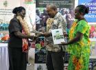 Western Province Minister of Women, Youth and Sports receives the first-ever women’s policy from Provincial Secretary Jeffery Wickham and Women’s Desk Officer Lisi Wong in Gizo on 18 July 2018. Photo: UNDP/Merinda Valley