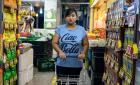 Nurachayatun Siti, a 35-year-old Indonesian domestic worker from Surabaya Java, does the family shopping early Saturday morning in Sembawang Hills Estates, Singapore. This is Nur's second job as a domestic worker in Singapore.  The first when she was 19, 