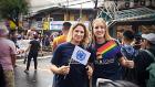 (from left) Rebecca Singleton of UN Women and Kate O'Shannessy of International Organization for Migration show their support at the Metro Manila Pride march on 29 June. Photo: Alecs Ongcal