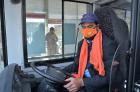 Driver of BRT bus in Peshawar wears orange mask and scarf to show solidarity with 16 Days of Activism against GBV. Photo: UN Women/Habib Asgher