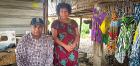 Lilian and Joseph Laki pose at her stall in Wewak market in August 2020. Photo: UN Women/Goodshow Bote