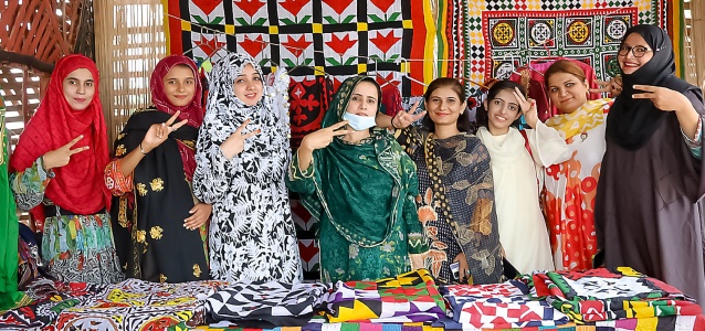Women sell handicrafts on 13 July 2021 at the Peace Café in Thatta city, Pakistan. The café, a women’s gathering place, was established with the support of UN Women. Photo: UN Women/Anam Abbas