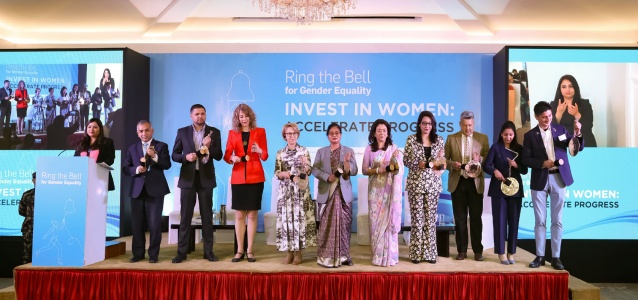 Keynote speakers ring the bell to signify their commitment to gender equality. Photo Credit: Laxmi Narayan/UN Women
