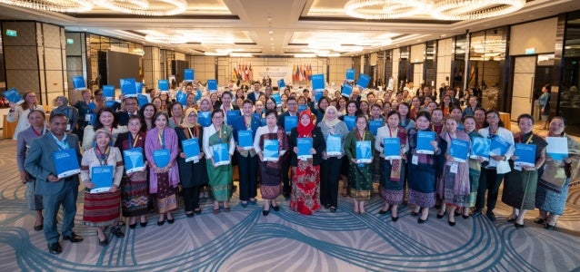 ASEAN representatives and development partners pose for a group photo during the launch of the “ASEAN Guidelines for Developing National Standard Operating Procedures for a Coordinated Response to Violence against Women and Girls” on the sidelines of the 3rd ASEAN Women Leaders’ Summit held in Vientiane, Lao PDR.