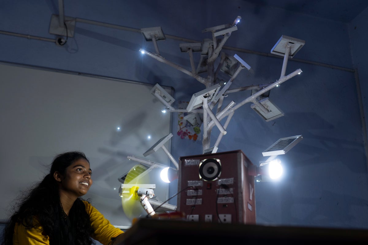 18-year-old high school student, Dipika Kumari, resident of Dantoo village in Jharkhand, demonstrates the working of a solar-powered device she designed with her group to address the problem of power outages in their village during cyclones. 